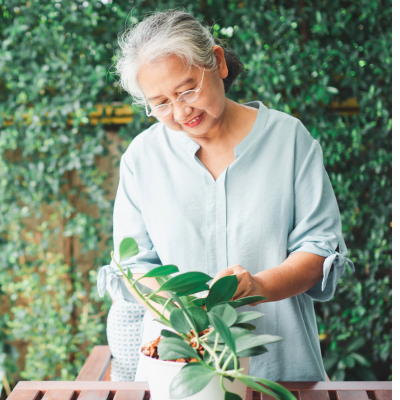 Older woman gardening as a spring activity for seniors.