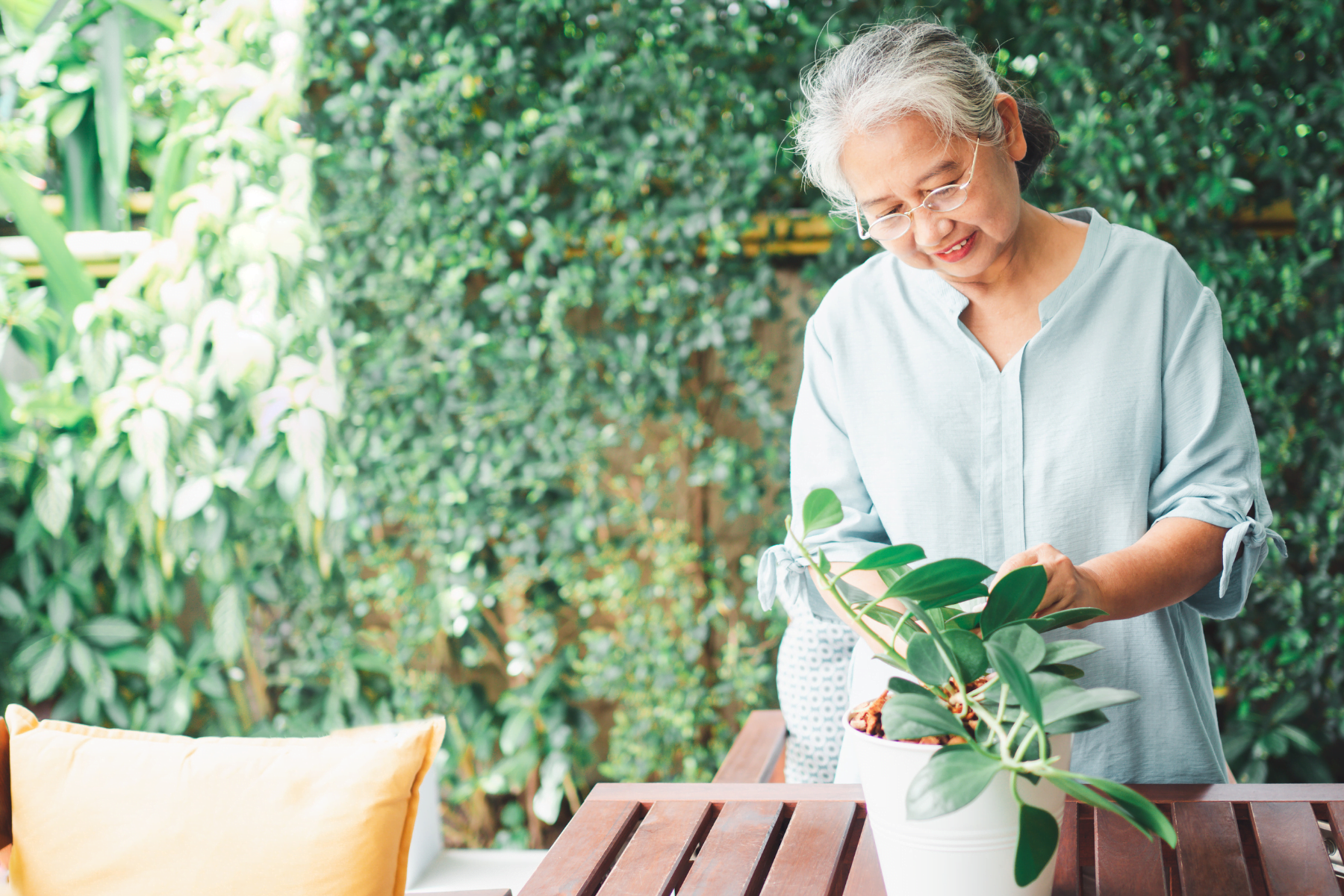 Older woman gardening as a spring activity for seniors