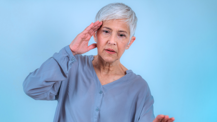 Woman experiencing symptoms of vertigo.